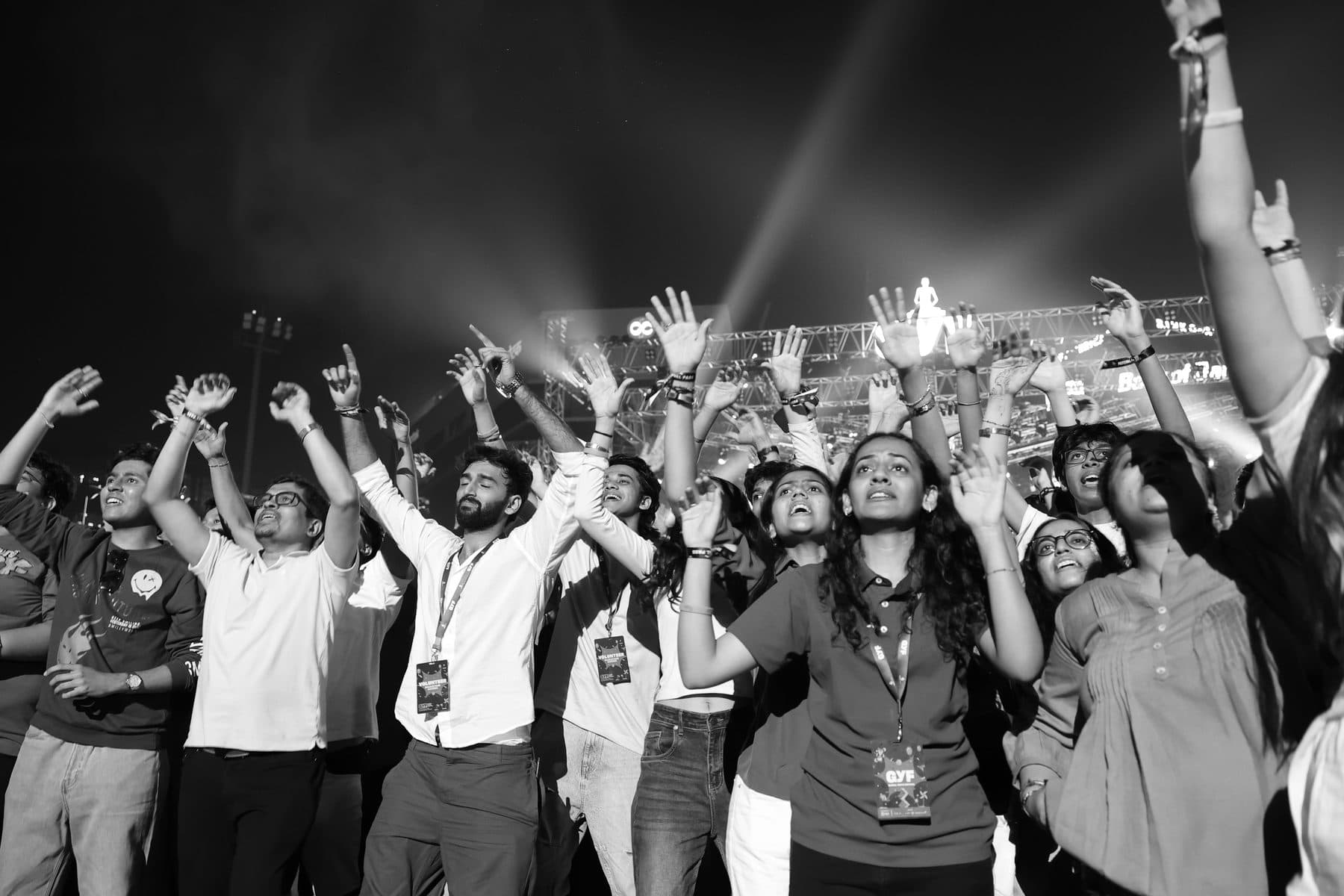 Young people with their hands in the air at GYF